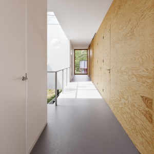 We wnętrzach dominują drewniane powierzchnie. Sosnowe panele przyjęły funkcję ścian, mobilnych drzwi, a nawet szafek, łóżka czy obudowy kominka. Projekt: i29 interior architects. Fot i29 interior architects.