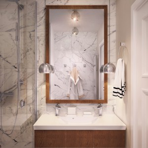 Ściany i podłogi w łazience i toalecie zaplanowano w marmurowym wykończeniu. Szlachetny materiał nadaje przestrzeni luksusowy charakter. Projekt: Studio projektowe Geometrium.