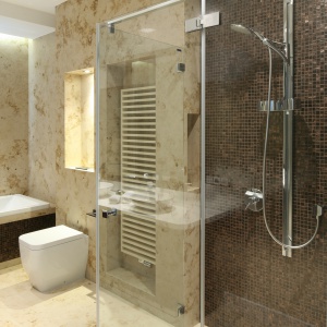 Kabina prysznicowa nie ma tradycyjnego brodzika. Ścianę w niej wykończono błyszczącą mozaiką.   Fot. Bartosz Jarosz.
