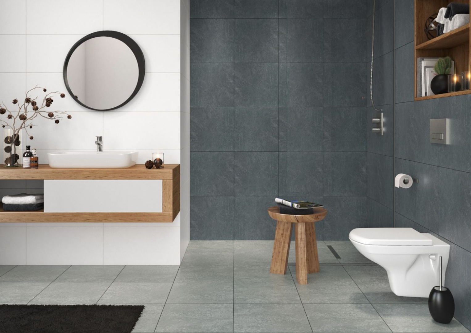 Aranżacja łazienki stworzona przez producenta płytek ceramicznych. Z szarymi gresami i nowoczesną stylistyką idealnie komponuje się okrągłe lustro w asymetrycznej ramie. Fot. Cersanit