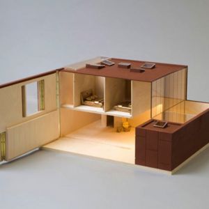 Designerskim modelem jest również domek studia David Adjaye Associates, wyróżniający się mebelkami w kolorze złota.Fot. www.thegrid.soup.io