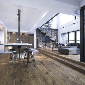 Postarzane drewniane podłogi doskonale komponują się ze szkłem, stalą czy architektonicznym betonem, dlatego stanowią idealne uzupełnienie industrialnych i loftowych aranżacji. Fot. Jawor-Parkiet