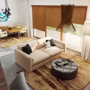 Aby zaakcentować jednolity styl przestrzeni dziennej zastosowano zarówno w salonie, jak i jadalni podobne dywany. Projekt domu Zb5, Zespół Z500