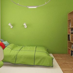 Zielone akcenty ocieplają i ożywiają wnętrze pokoju dziecka. Fot. Z500