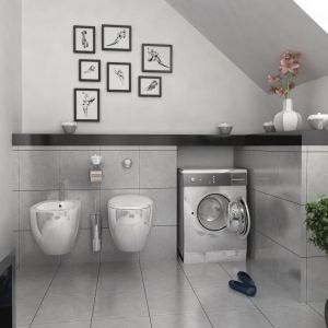 Szara łazienka zaprojektowana jest minimalistycznie. Połysk metalu i szarość betonu uzupełniają tu drobne czarne akcenty. Fot. Dom dla Ciebie Pracownia Projektowa Archeco 