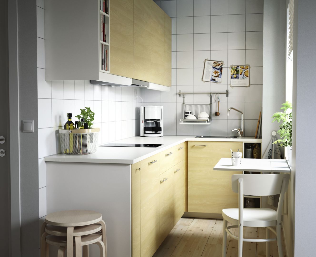 Małe kuchnie dobrze jest urządzić zabudową w kształcie litery L. Dzięki temu będzie ona funkcjonalna i estetyczna. Fot. IKEA