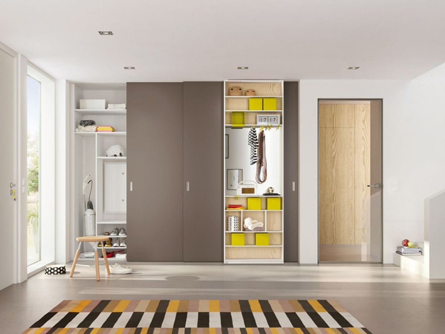 Wnętrze szafy na zamówienie można wyposażyć w funkcjonalne przegródki, półki oraz szuflady. Fot. Raumplus