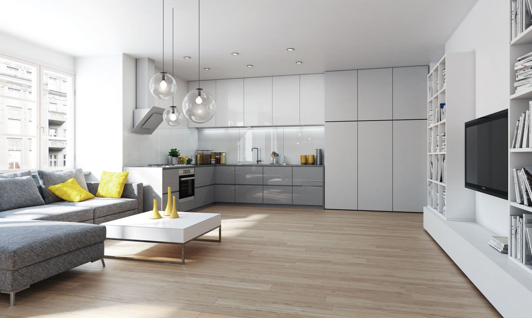 W małych mieszkaniach powinny przeważać jasne barwy, które optycznie powiększają przestrzeń - zarówno salonu, jak i kuchni. Fot. Komandor