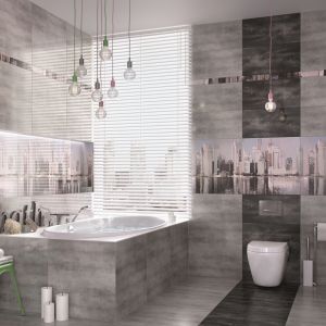 Konkret firmy Ceramstic – szare płytki stylizowane na beton; wieżowce na dekorach pozwalają stworzyć w łazience niepowtarzalny klimat. Fot. Ceramstic 