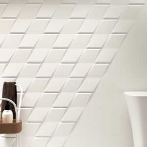 Pomysł na białą łazienkę. Geometryczne płytki z efektem 3d, np. z kolekcji Evoke od ZYX, wprowadzą do aranżacji odważną nutę nonszalancji. Fot. Materiały prasowe Greston