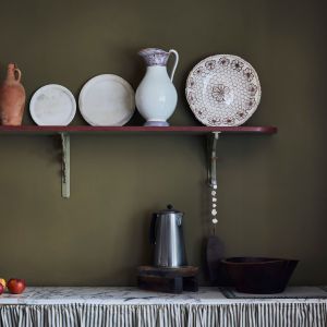 Annie Sloan - Kitchen - Chalk paint in Olive, Chateau Grey and Primer Red shelf, Ticking in Olive curtain - Lifestyle - Portrait