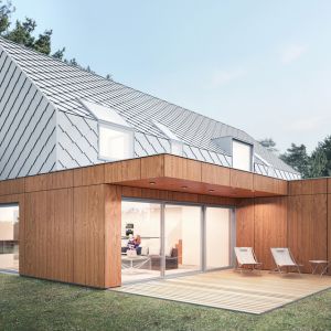 Architekci zaprojektowali dom w formie „nowoczesnej stodoły” z dwuspadowym dachem, postawiony na parterowym, drewnianym „pudełku” z płaskim dachem. Projekt: Magdalena Gierczak, Zbigniew Gierczak