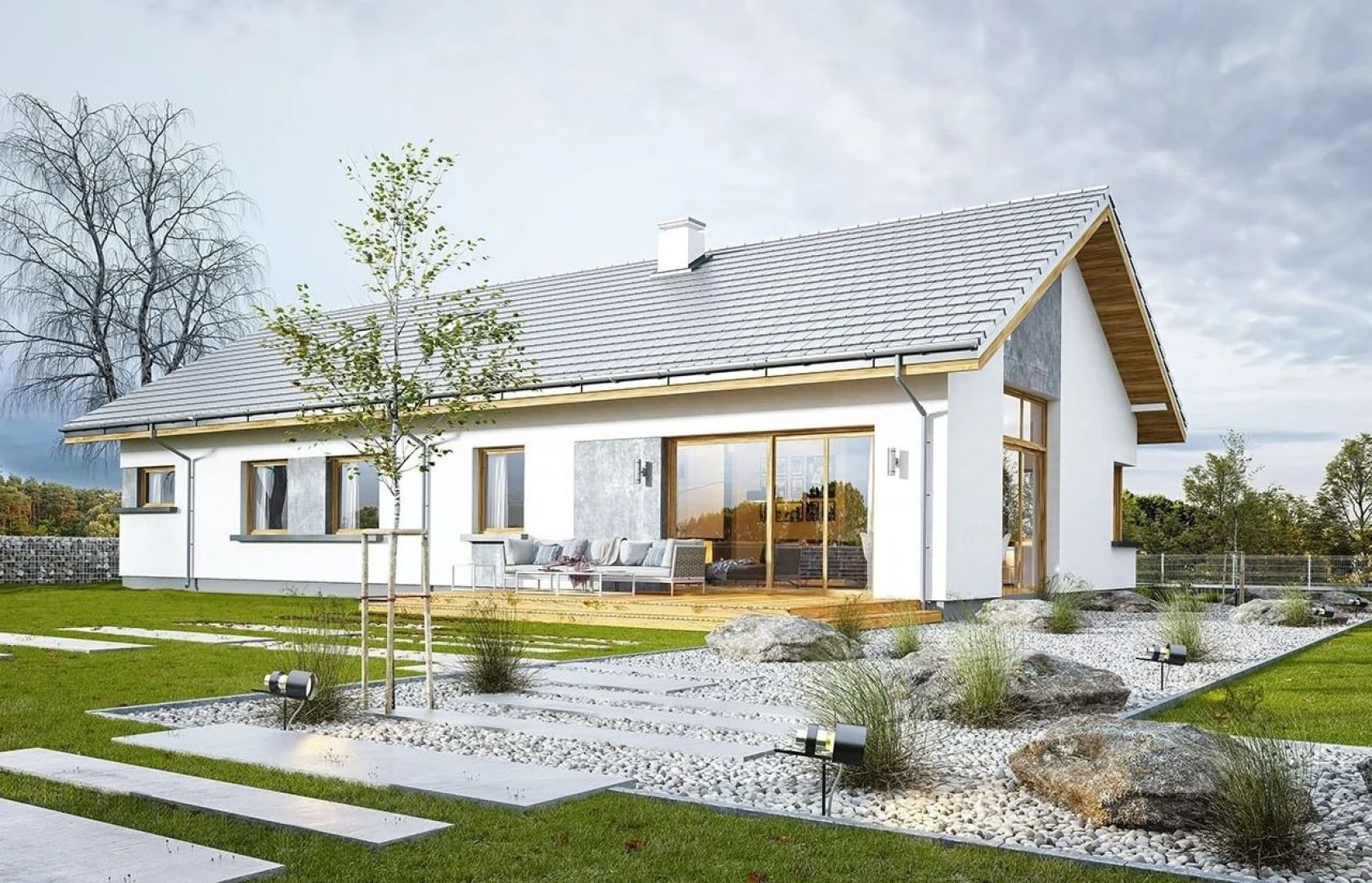 W szczycie i z tyłu domu salon zdobią duże przeszklenia otwierające wnętrze na otaczający ogród. Projekt: arch. Michał Gąsiorowski. Fot. MG Projekt