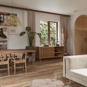 Podłoga w całym domu wykonana jest z drewnianych, stylizowanych desek. Projekt i zdjęcia: Studio Rysik