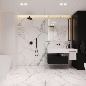 Na ścianach w łazience znalazły się czarno-białe spieki kwarcowe, które dodają przestrzeni elegancji. Projekt i wizualizacje: kaim.work