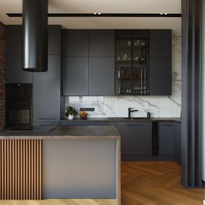 Proste oświetlenie w industrialnej, czarnej kuchni. Projekt: Marta Michalak-Najderek, m-studio. Fot. Radek Słowik