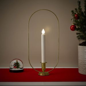 Świecznik LED z mosiądzu. Cena: 69,99 zł.  Fot. IKEA