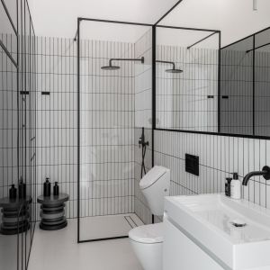 Nowoczesna łazienka w biało-czarnej kolorystyce. Projekt wnętrza: Piotr Łucyan, Art’Up Interiors. Zdjęcia: Mateusz Kowalik