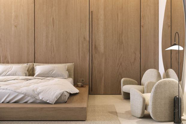 Sypialnia urządzona w stylu japandi jest ciepła i przytulna, spokojna i harmonijna. Doskonale łączą się tu gładkie powierzchnie drewna, kamienia oraz tafla dużego lustra o organicznych kształtach. Wnętrze jest także bardzo wygodne.<br />