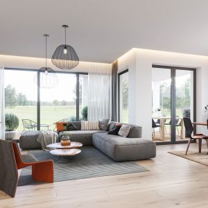 Z sieni przechodzimy do otwartej przestrzeni dziennej połączonego salonu z jadalnią i kuchnią.Projekt: arch. Michał Gąsiorowski. Fot. MG Projekt